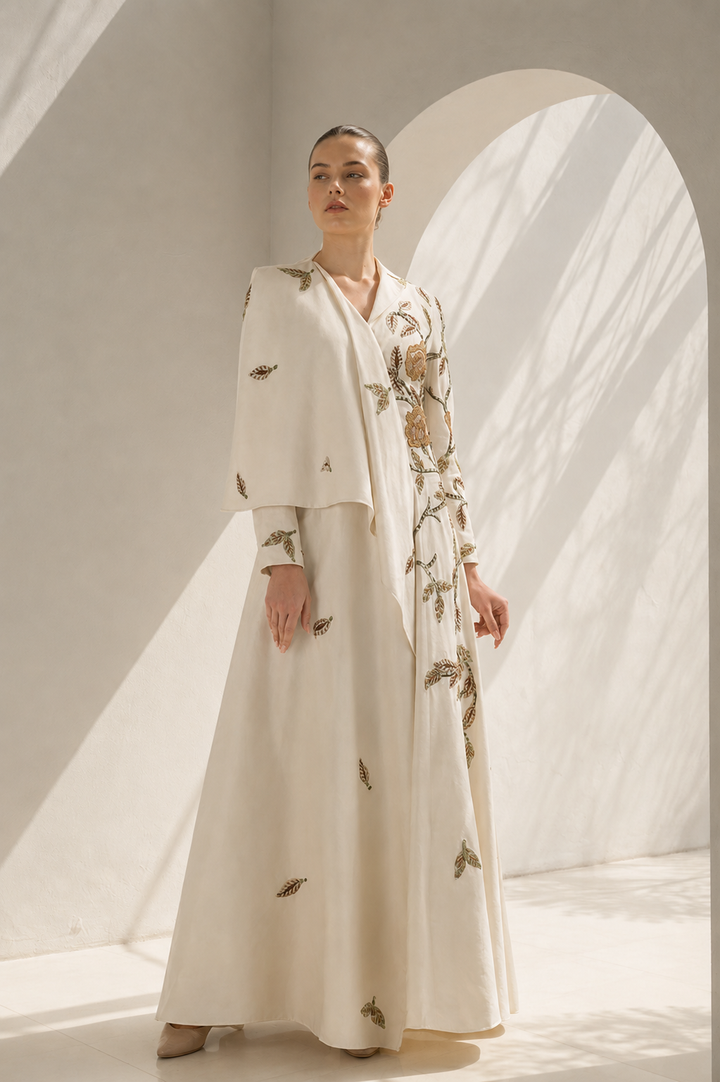 Ivory Gown With Cape-Like Elegance