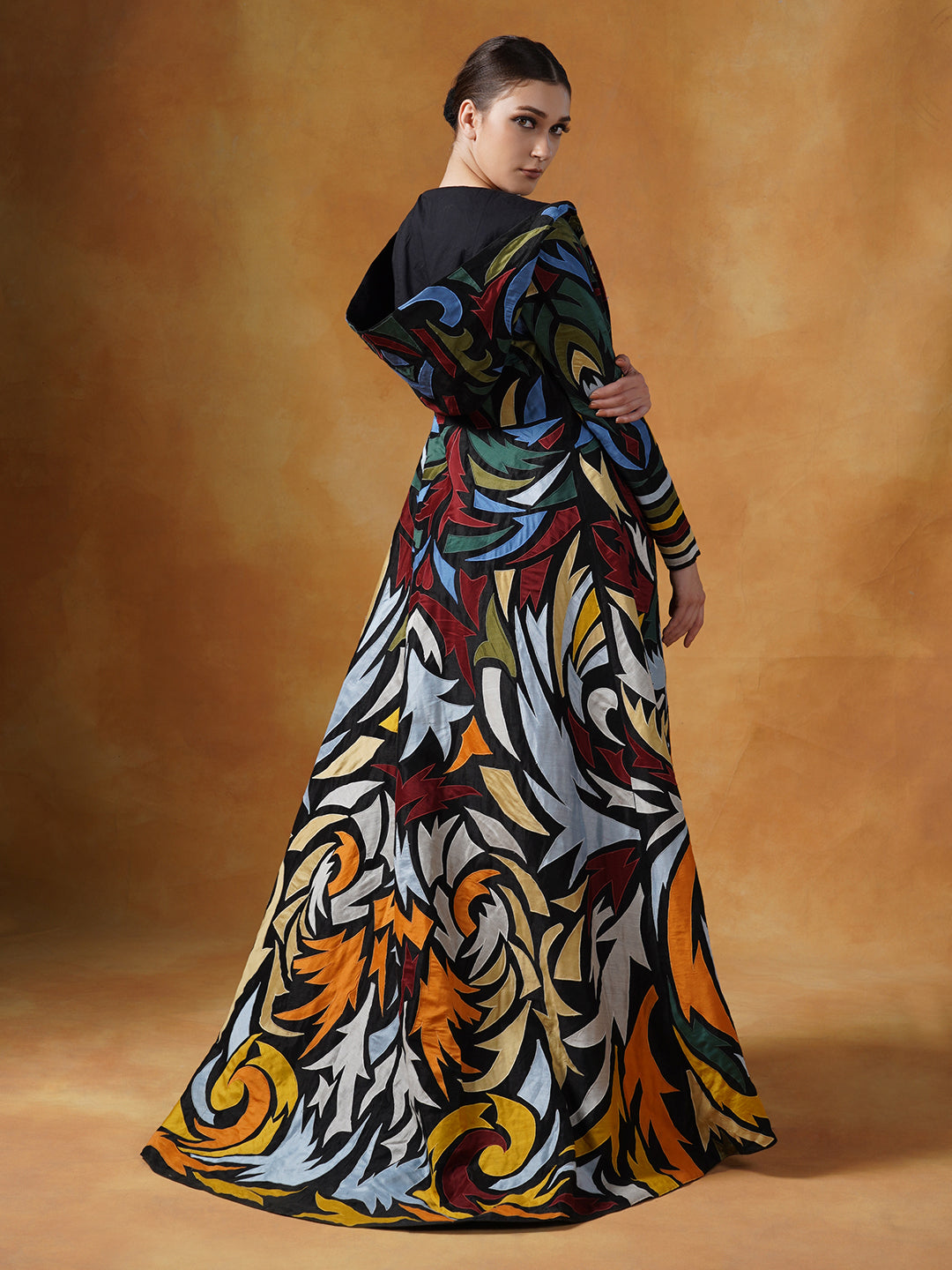 Hooded, floor length cotton silk gown,  surfaced with colorful appliqué work all over.