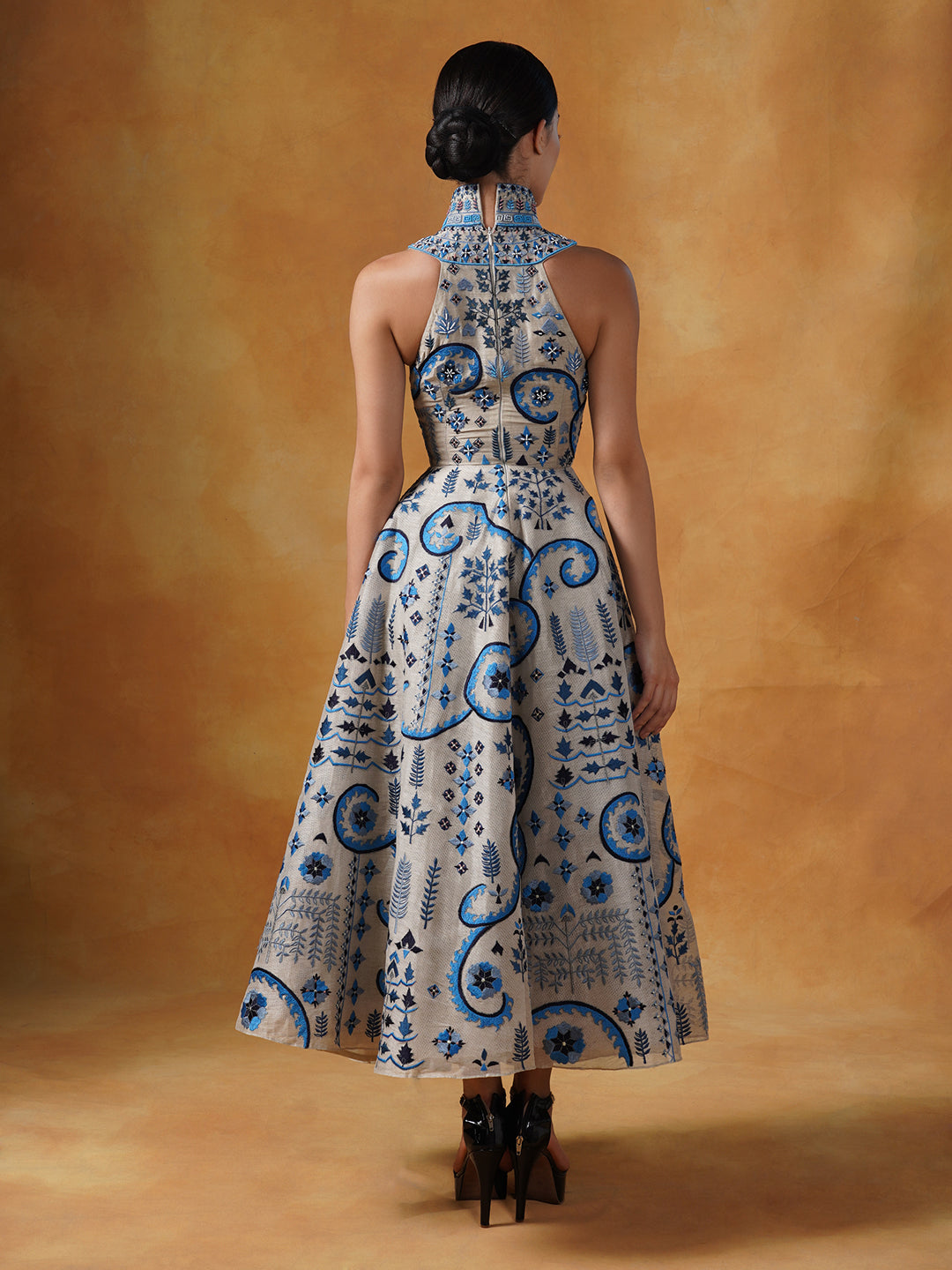 Embroidered A-line gown in linen silk with a stylised high neck