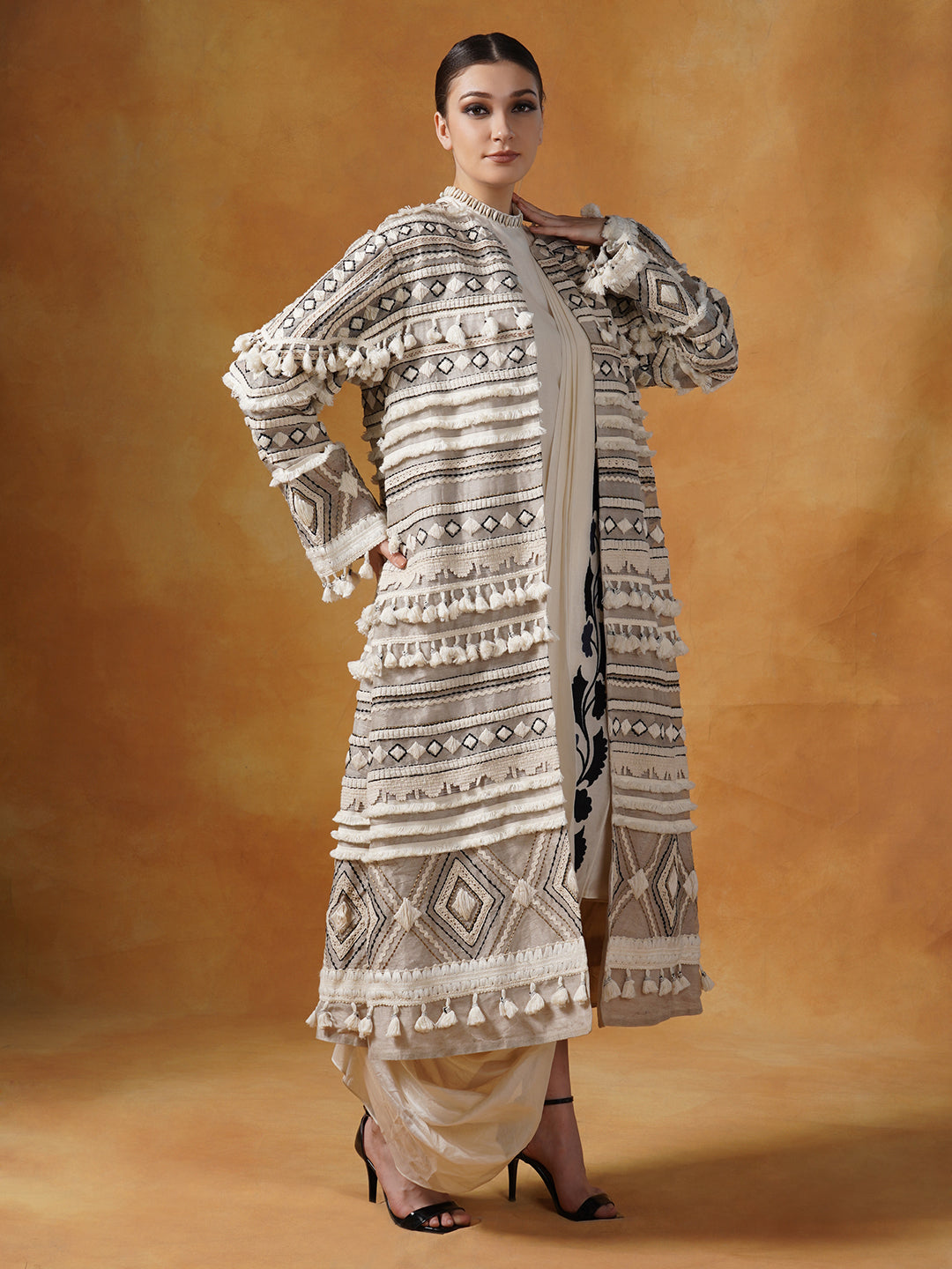 Embroidered bohemian style long jacket in linen silk, topped on an ivory cotton silk drape dress