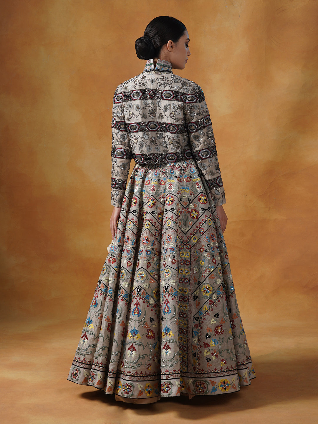 Fully embroidered lehenga set in linen silk base that is topped with a matching crop jacket.