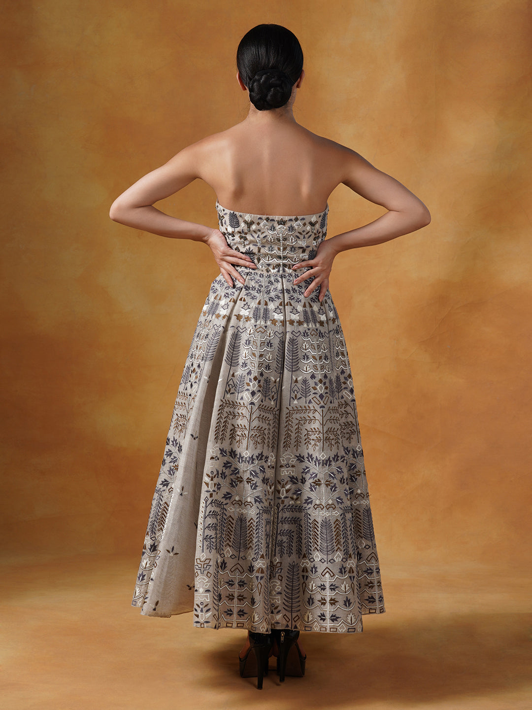 A gorgeous tube gown in linen silk that is beautifully embroidered in silk yarns.