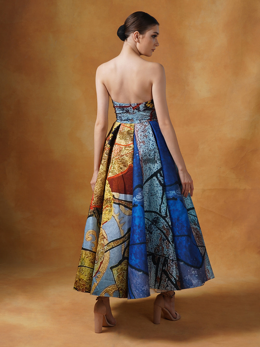 A fun printed tube gown with smart pleats in cotton silk.