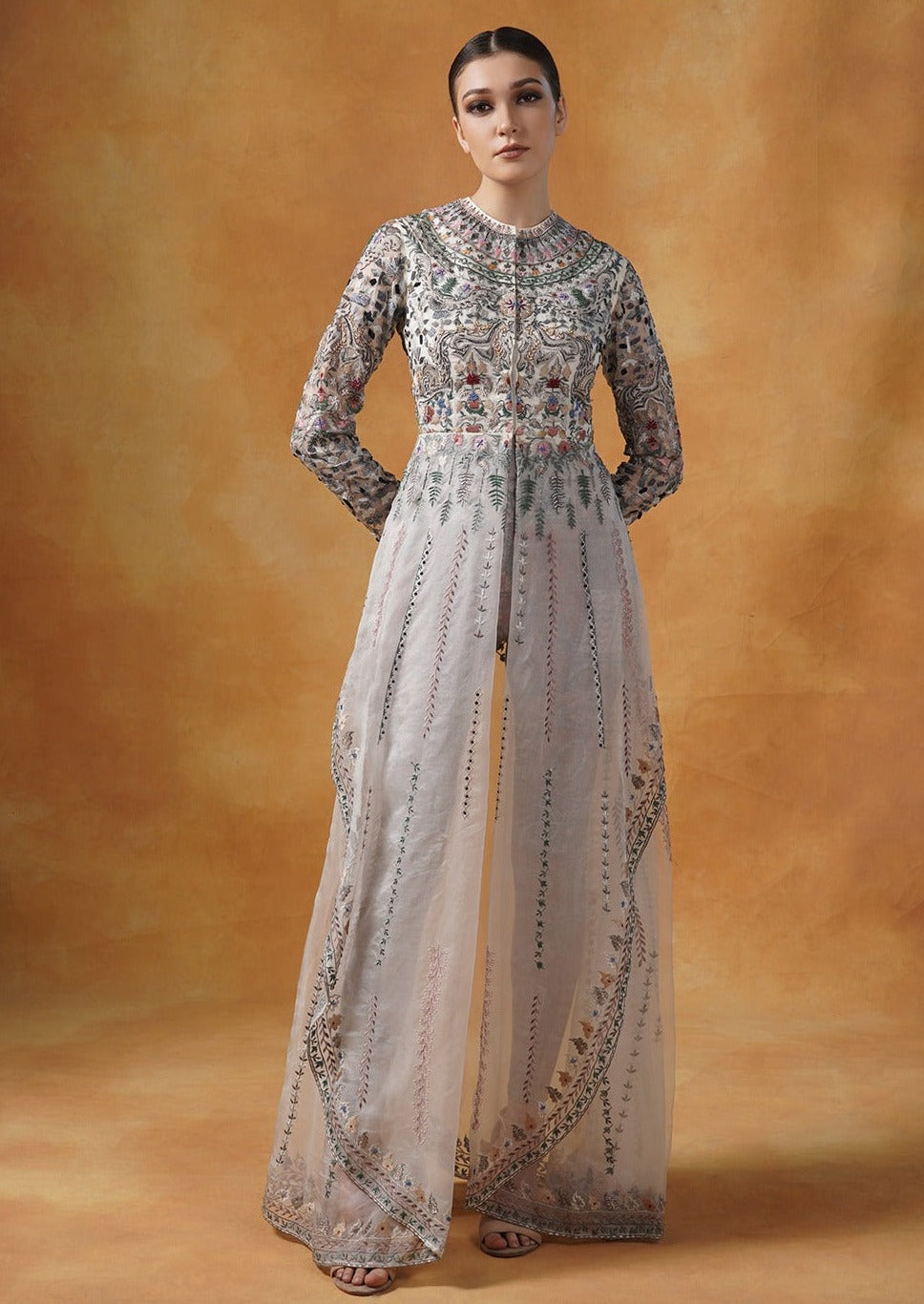 An organza jacket that is beautifully embroidered in silk yarns and pearl.