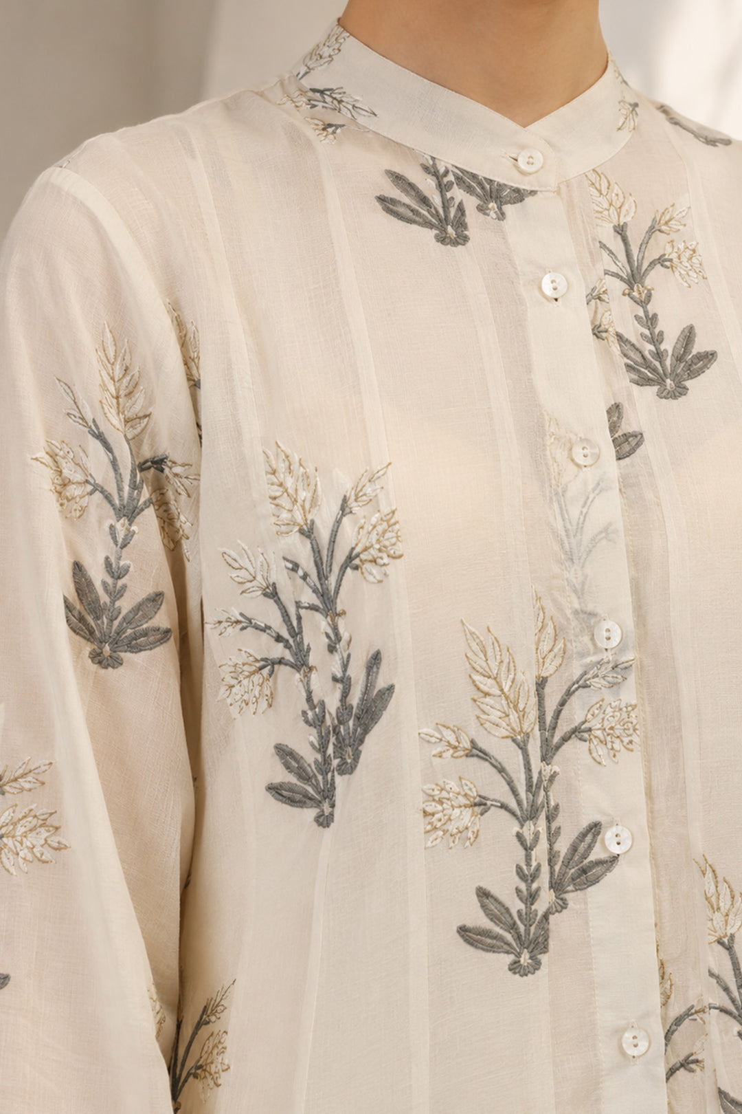 Ivory layered ensemble adorned with printed kurta paired with flared skirt.