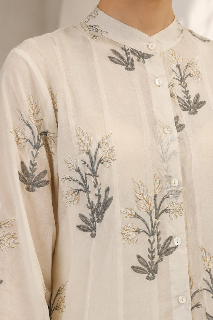 Ivory layered ensemble adorned with printed kurta paired with flared skirt.