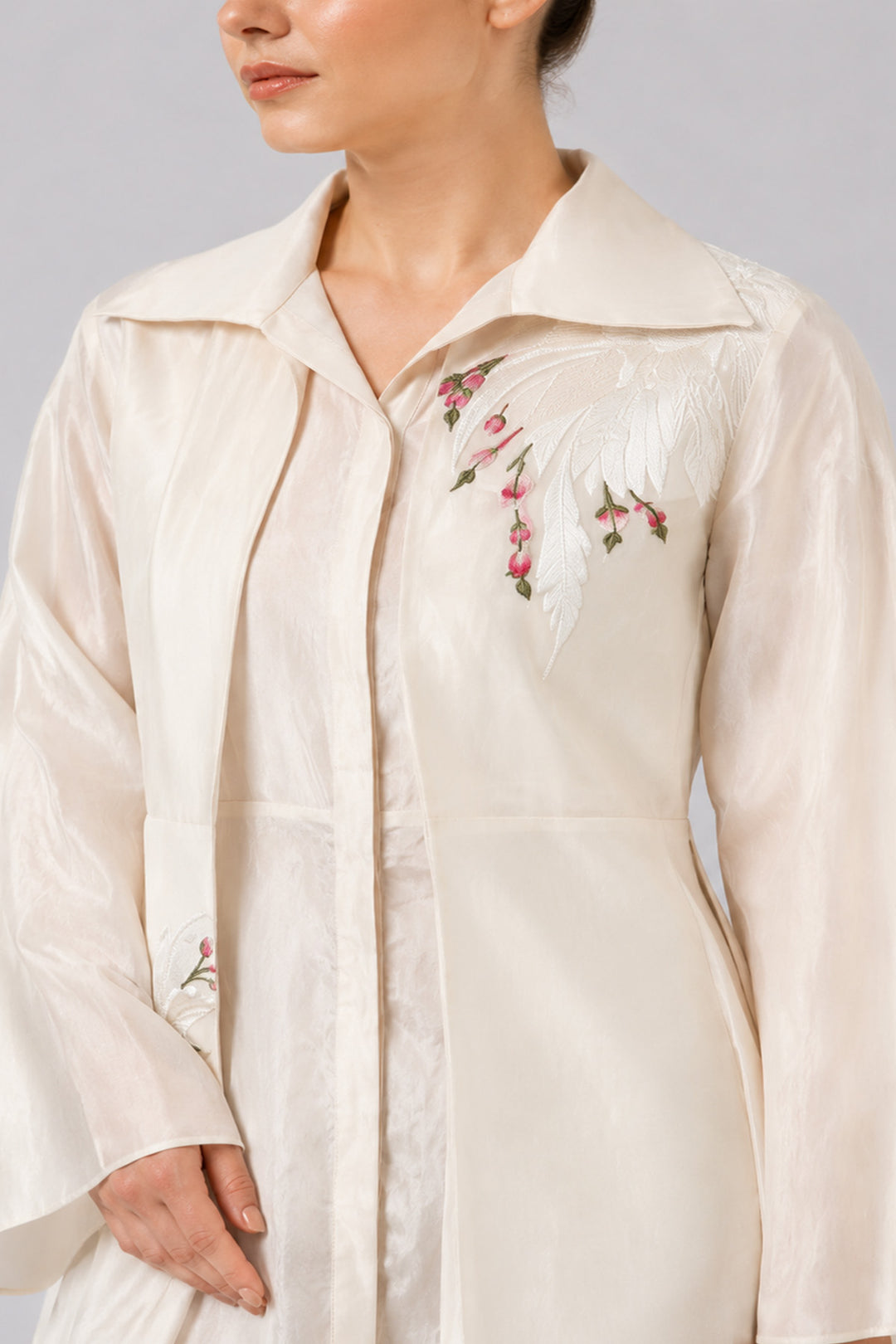 Ivory Layered Ensemble With Embroidered Accents And Fluid Draped Silhouette