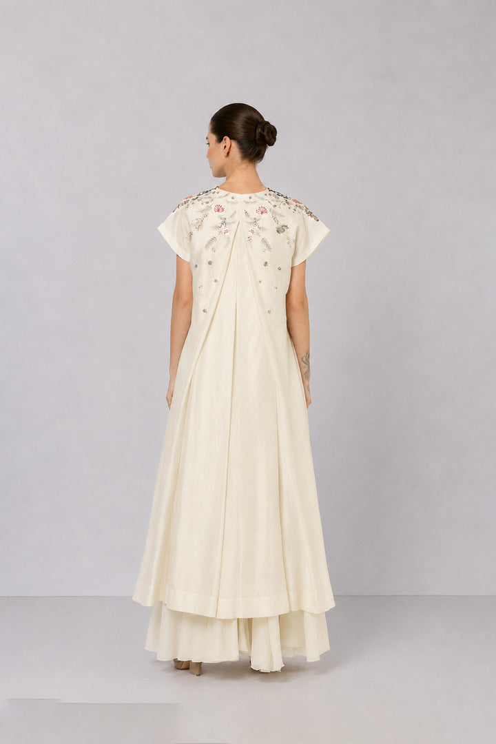 Ivory Embroidered Dress With Geometric Detailing And Layered Flared Hem.