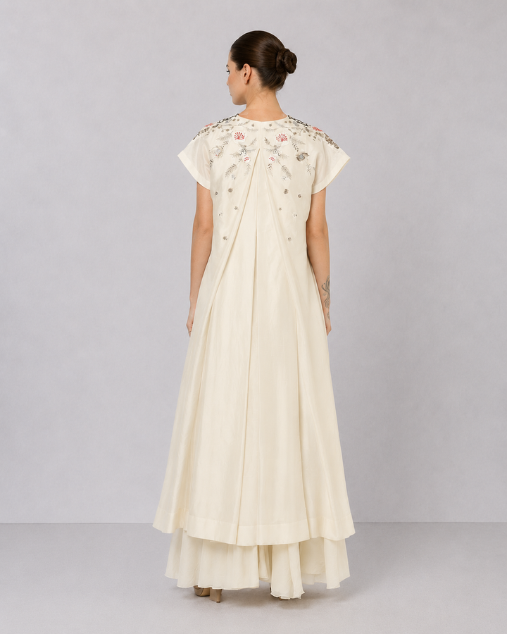 Ivory Embroidered Dress With Geometric Detailing And Layered Flared Hem.