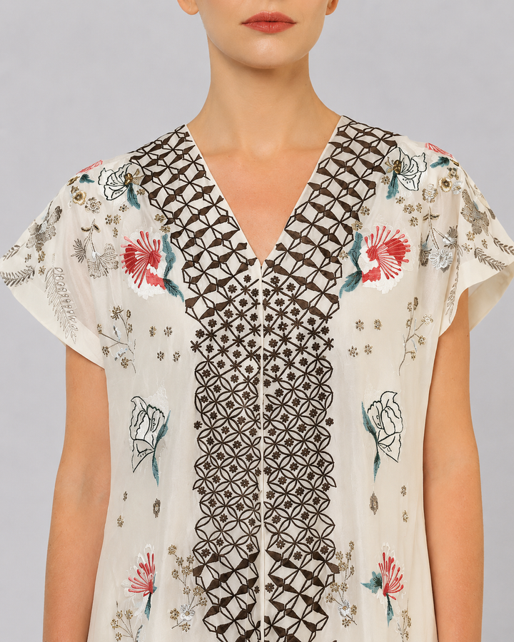 Ivory Embroidered Dress With Geometric Detailing And Layered Flared Hem.