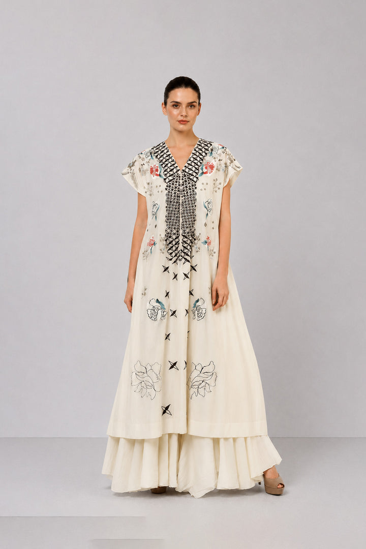 Ivory Embroidered Dress With Geometric Detailing And Layered Flared Hem.