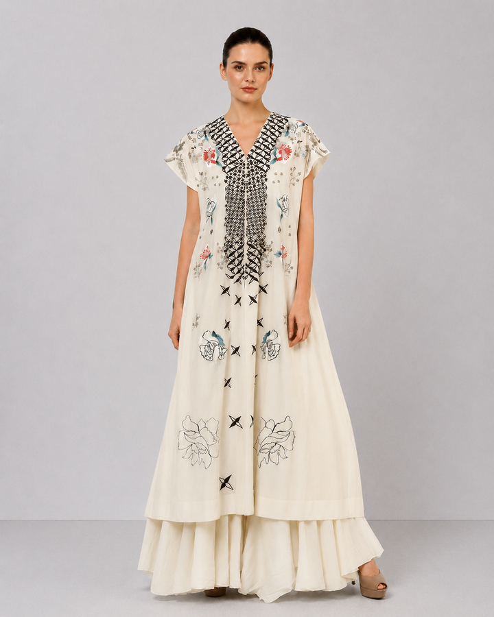 Ivory Embroidered Dress With Geometric Detailing And Layered Flared Hem.