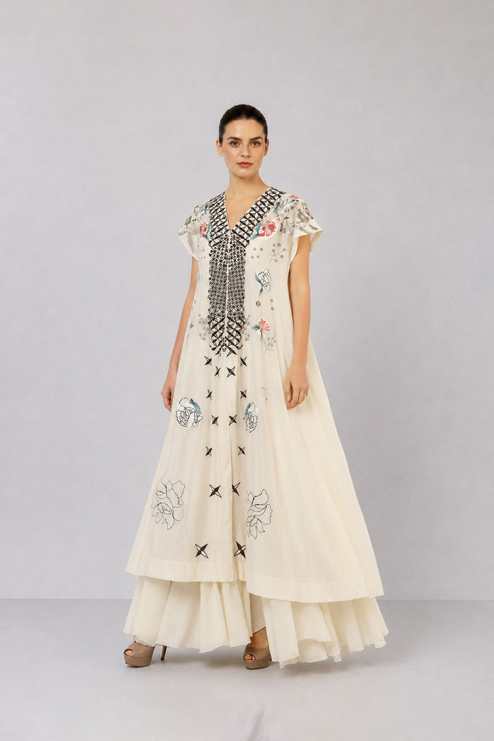 Ivory Embroidered Dress With Geometric Detailing And Layered Flared Hem.