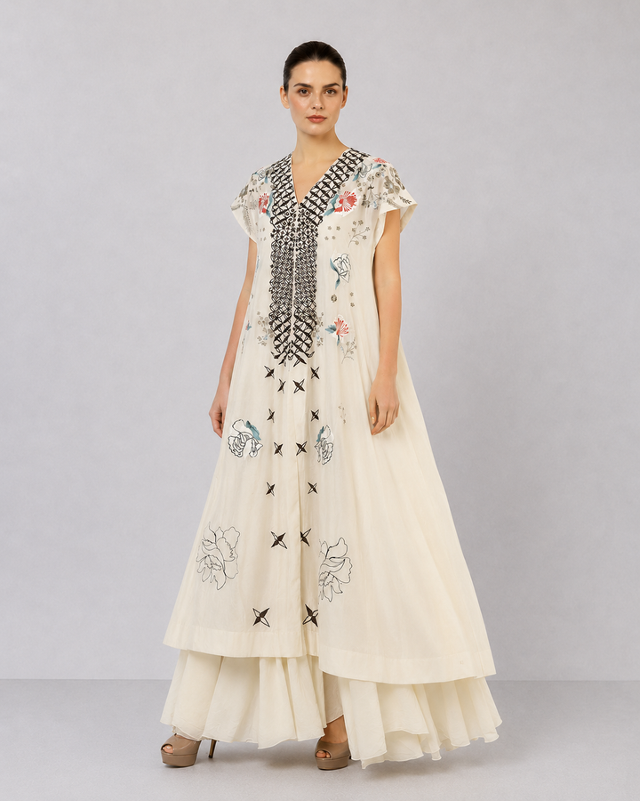 Ivory Embroidered Dress With Geometric Detailing And Layered Flared Hem.