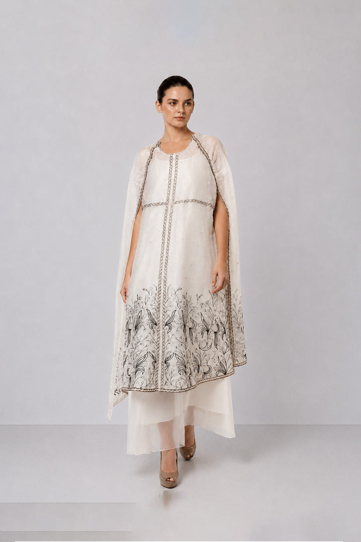 Ivory Embroidered Cape Dress With Sheer Layering And Floral Motifs.