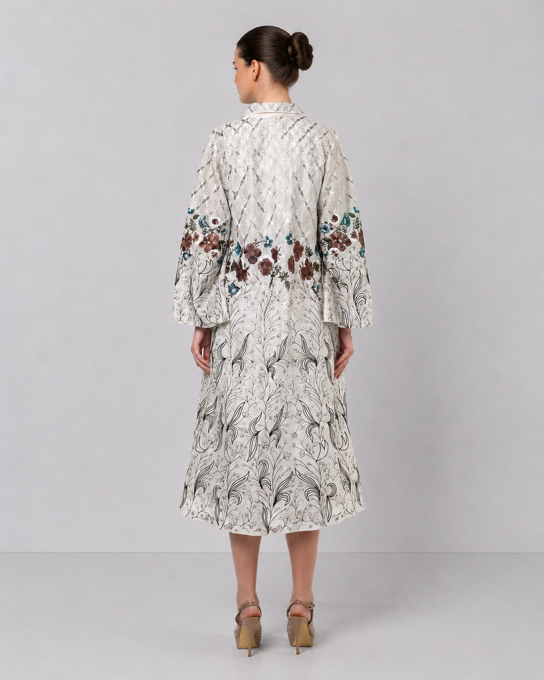 Ivory Long Jacket Paired With Crop Top &amp; Skirt Featuring Trench Overlay With Botanical Artwork.