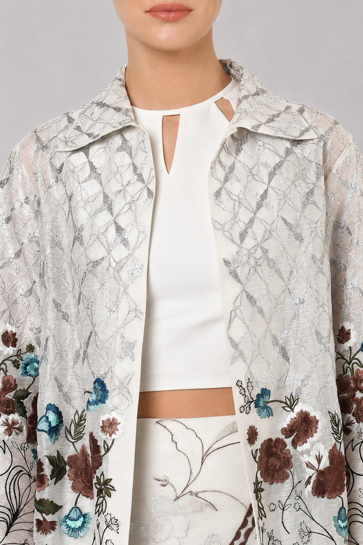 Ivory Long Jacket Paired With Crop Top &amp; Skirt Featuring Trench Overlay With Botanical Artwork.