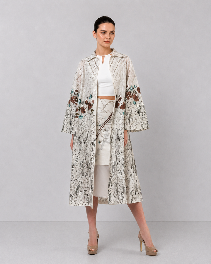 Ivory Long Jacket Paired With Crop Top &amp; Skirt Featuring Trench Overlay With Botanical Artwork.