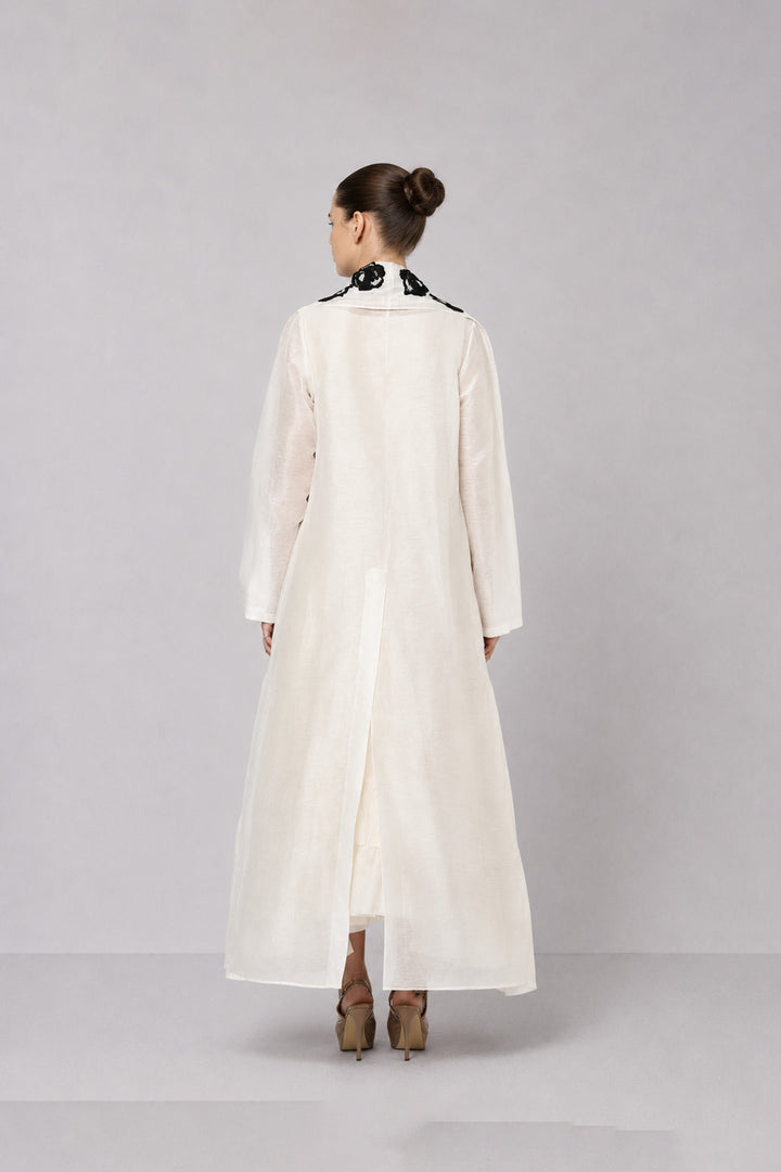 Ivory Tiered Dress With Floral Embroidered Bodice And Statement Applique Jacket.