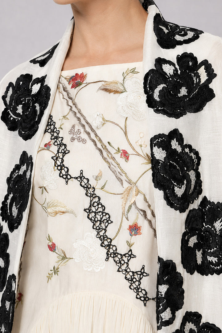 Ivory Tiered Dress With Floral Embroidered Bodice And Statement Applique Jacket.