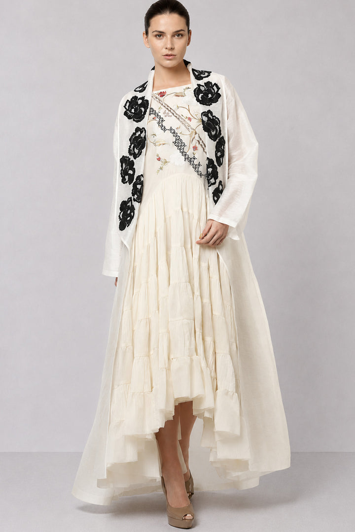 Ivory Tiered Dress With Floral Embroidered Bodice And Statement Applique Jacket.