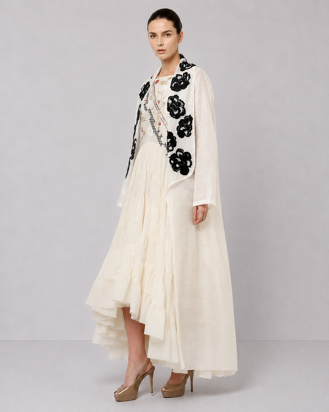 Ivory Tiered Dress With Floral Embroidered Bodice And Statement Applique Jacket.