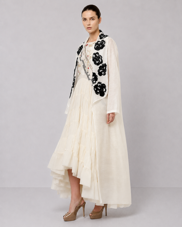 Ivory Tiered Dress With Floral Embroidered Bodice And Statement Applique Jacket.