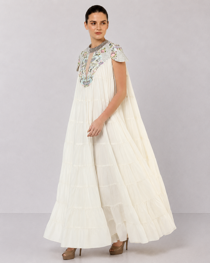 Ivory Tiered Gown With Embroidered Yoke And Cascading Ruffle Hem.