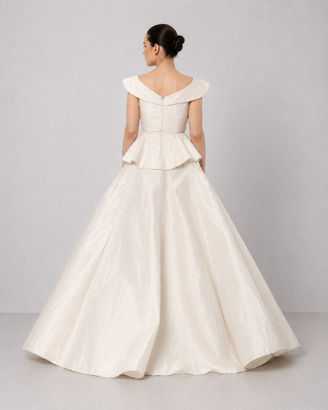 Ivory Floral Embroidered Peplum Gown With An Off-Shoulder Neckline And Voluminous Drape.
