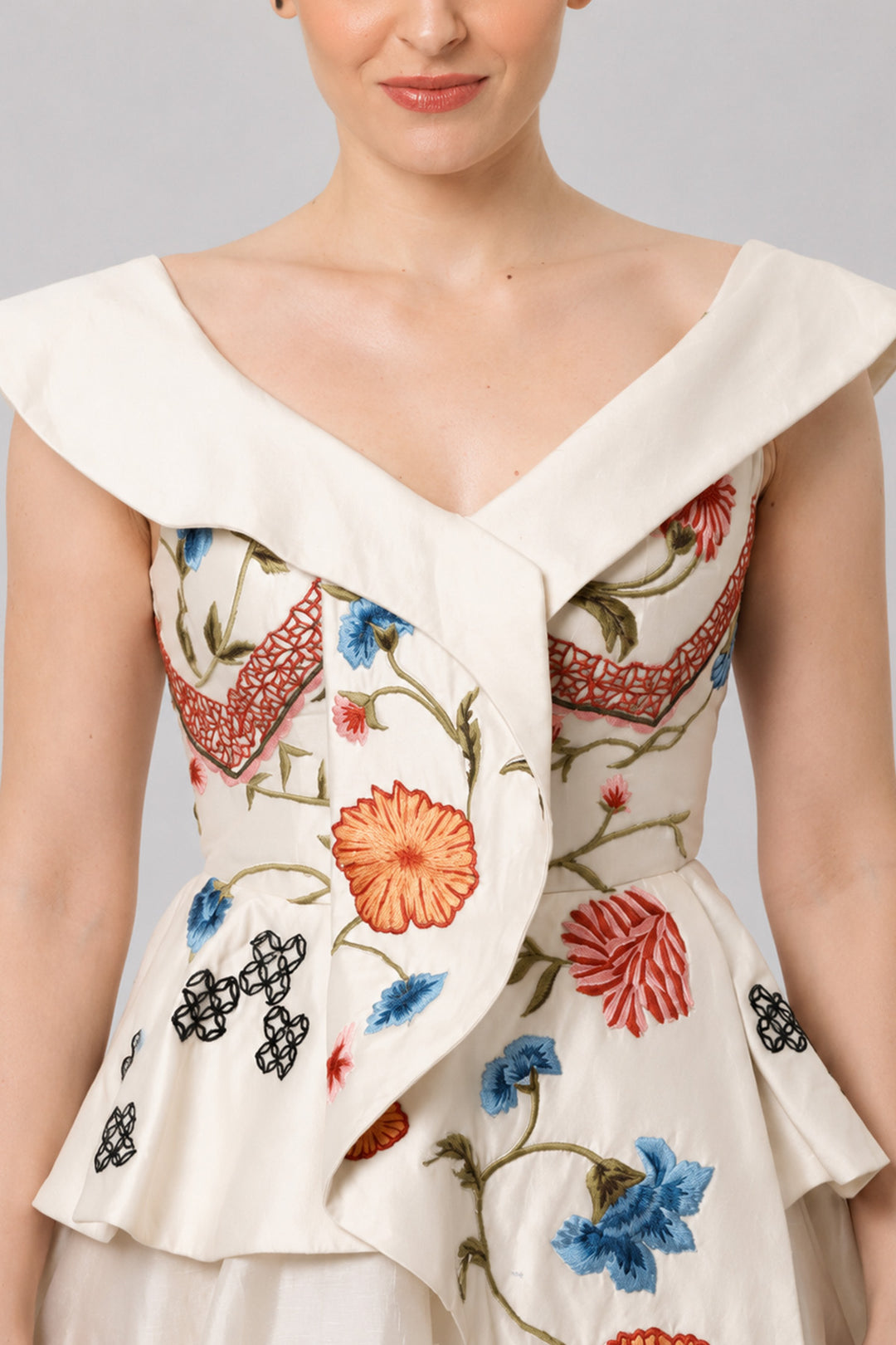 Ivory Floral Embroidered Peplum Gown With An Off-Shoulder Neckline And Voluminous Drape.