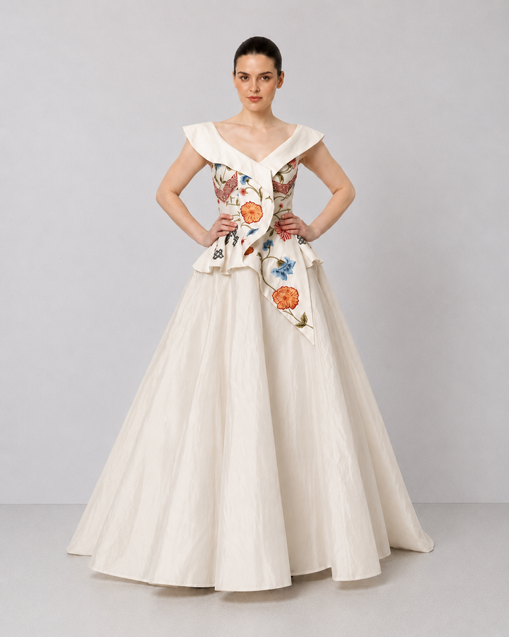 Ivory Floral Embroidered Peplum Gown With An Off-Shoulder Neckline And Voluminous Drape.