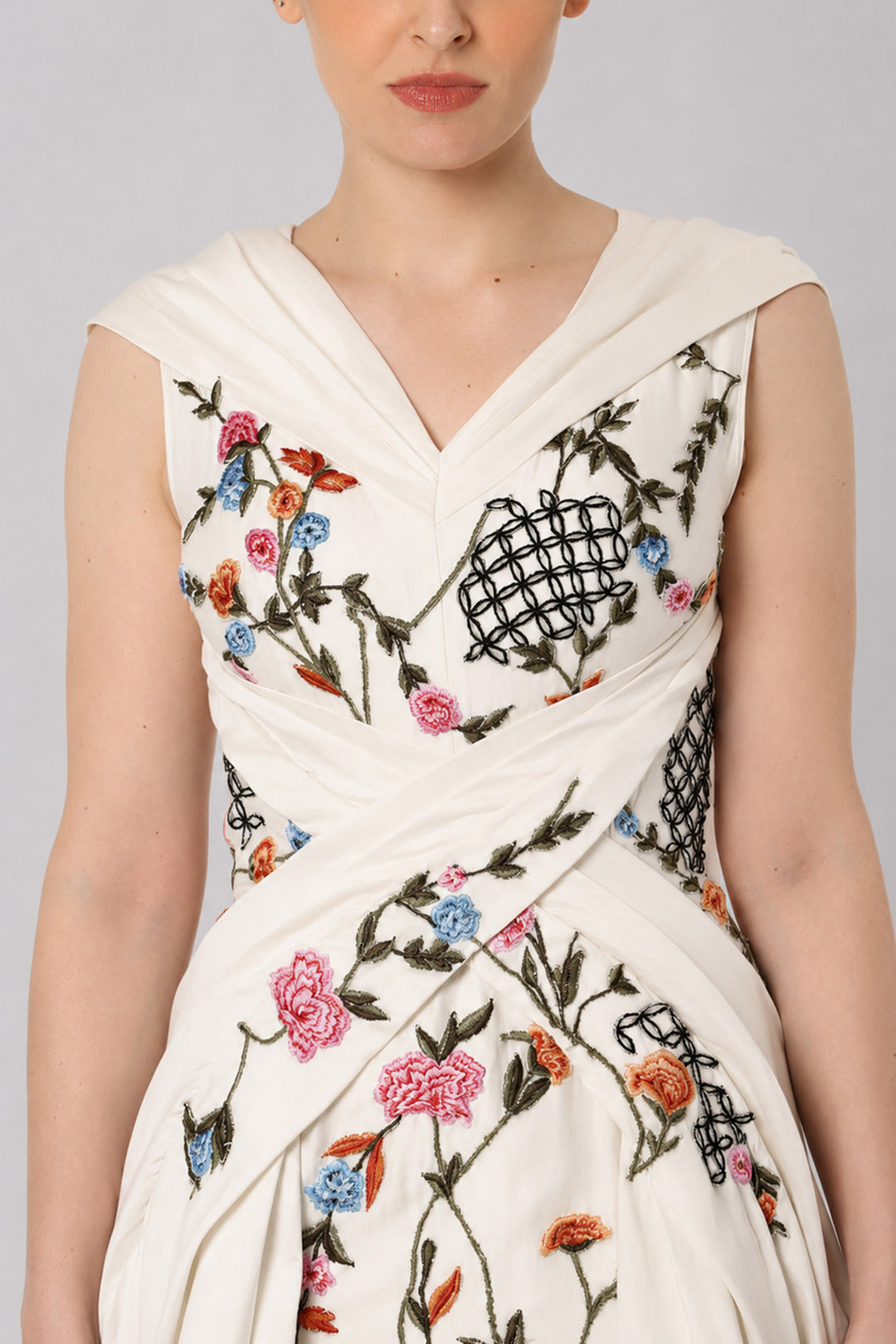 Ivory Embroidered Crossover Gown With Floral Artwork And Dramatic Side Drapes.