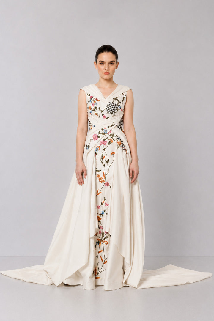 Ivory Embroidered Crossover Gown With Floral Artwork And Dramatic Side Drapes.