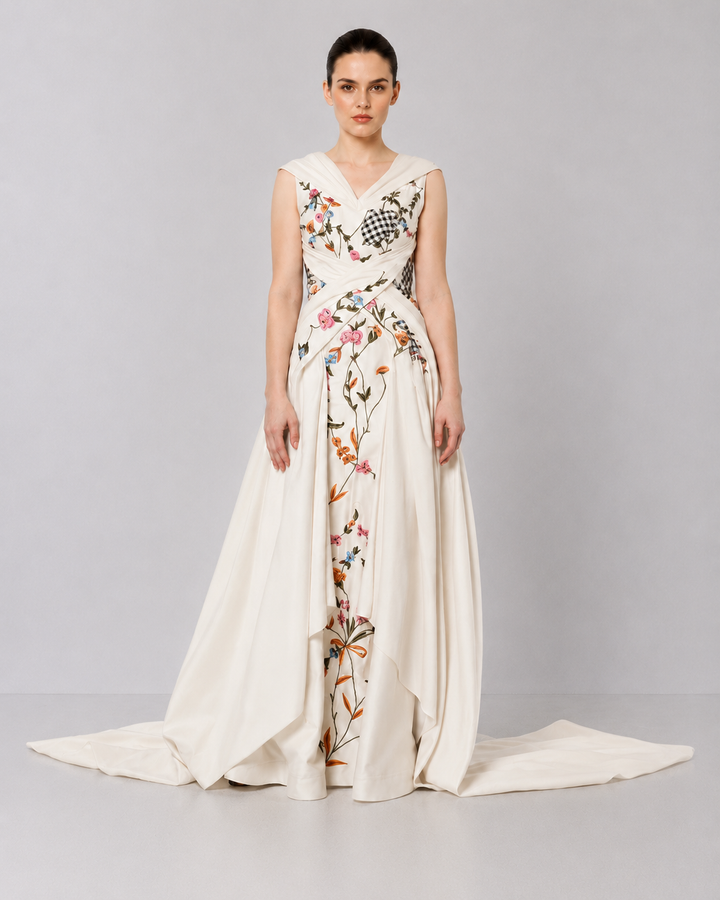 Ivory Embroidered Crossover Gown With Floral Artwork And Dramatic Side Drapes.