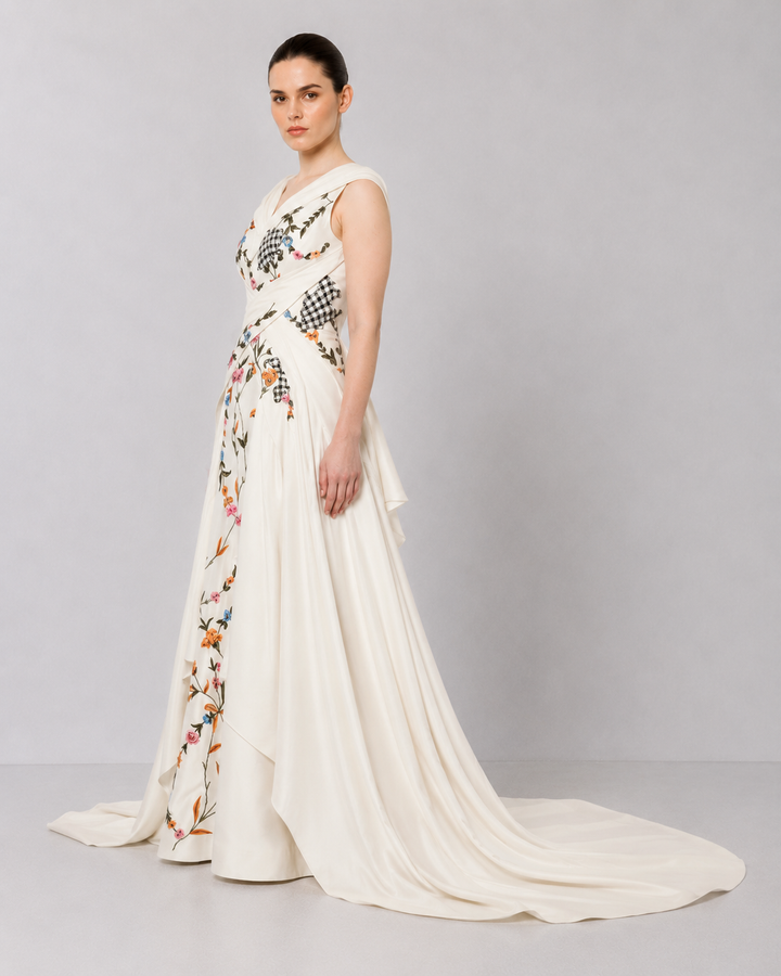 Ivory Embroidered Crossover Gown With Floral Artwork And Dramatic Side Drapes.