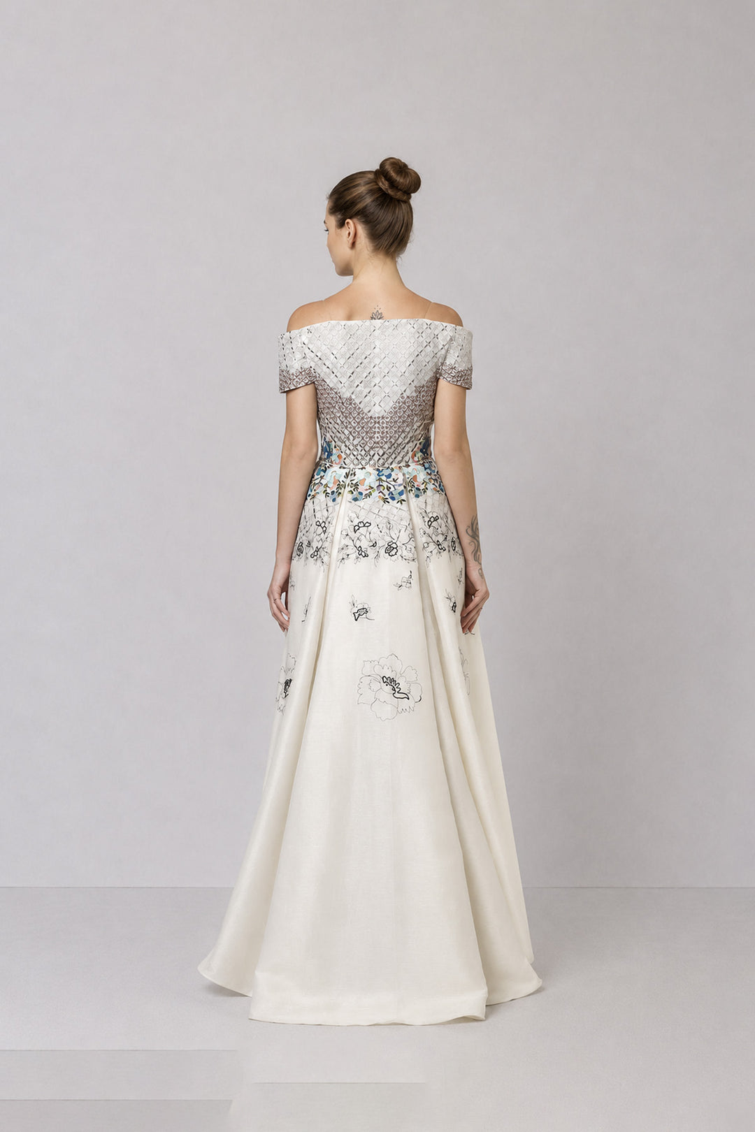 Ivory Off-Shoulder Dress With Embroidered Bodice And Dramatic High-Low Hem.
