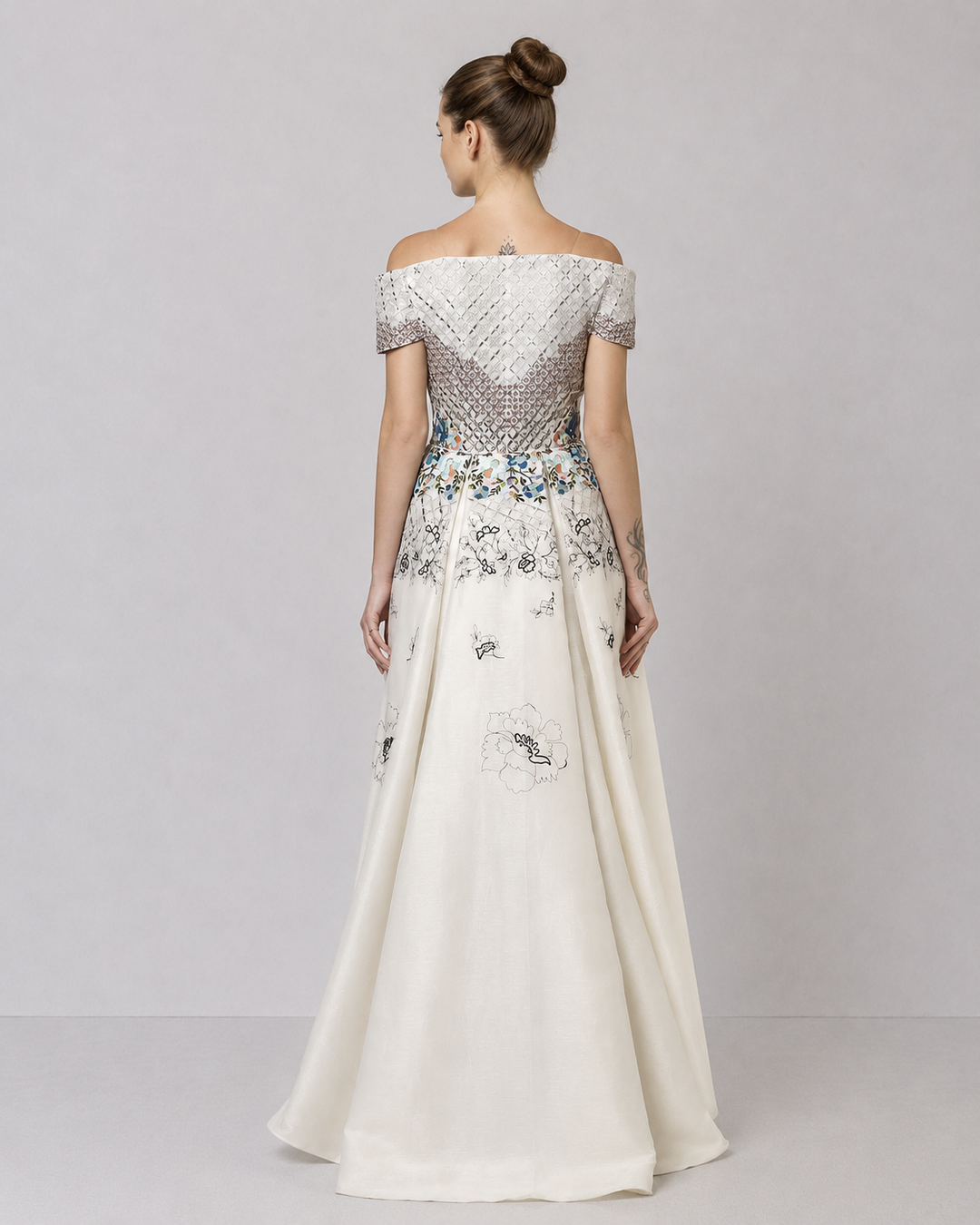 Ivory Off-Shoulder Dress With Embroidered Bodice And Dramatic High-Low Hem.