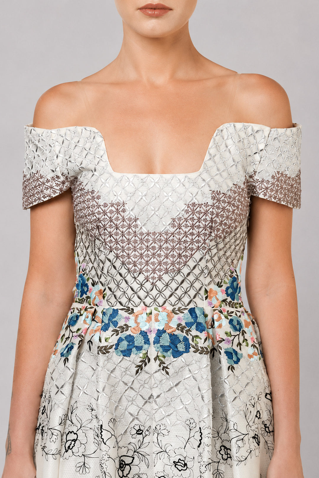 Ivory Off-Shoulder Dress With Embroidered Bodice And Dramatic High-Low Hem.