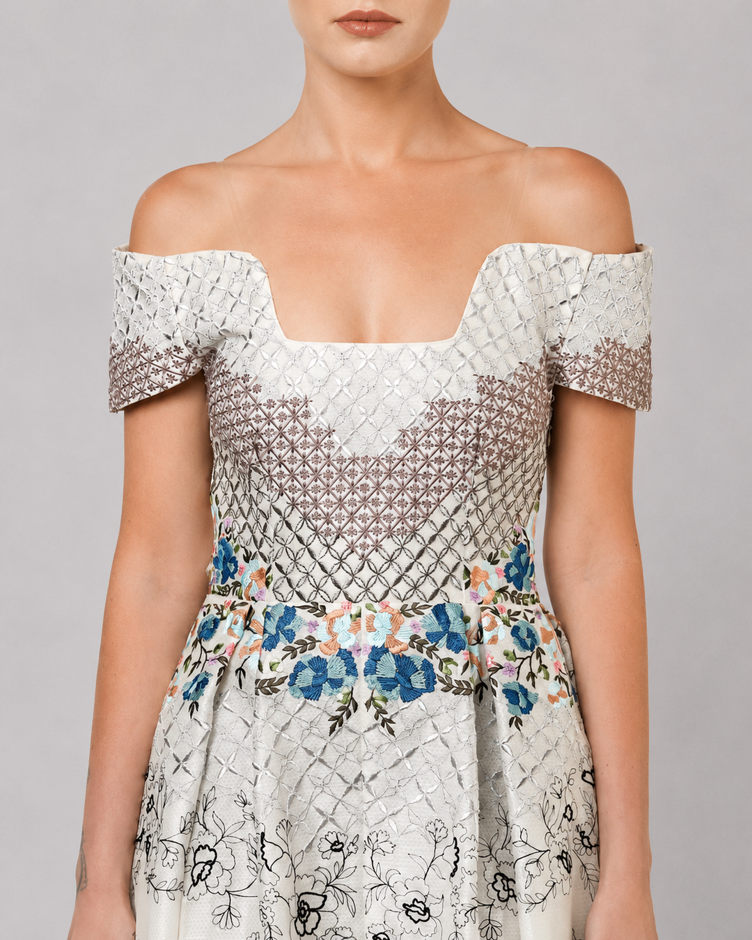 Ivory Off-Shoulder Dress With Embroidered Bodice And Dramatic High-Low Hem.
