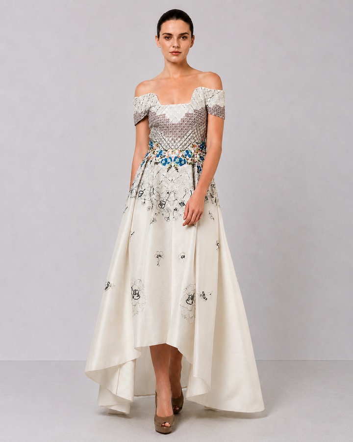 Ivory Off-Shoulder Dress With Embroidered Bodice And Dramatic High-Low Hem.