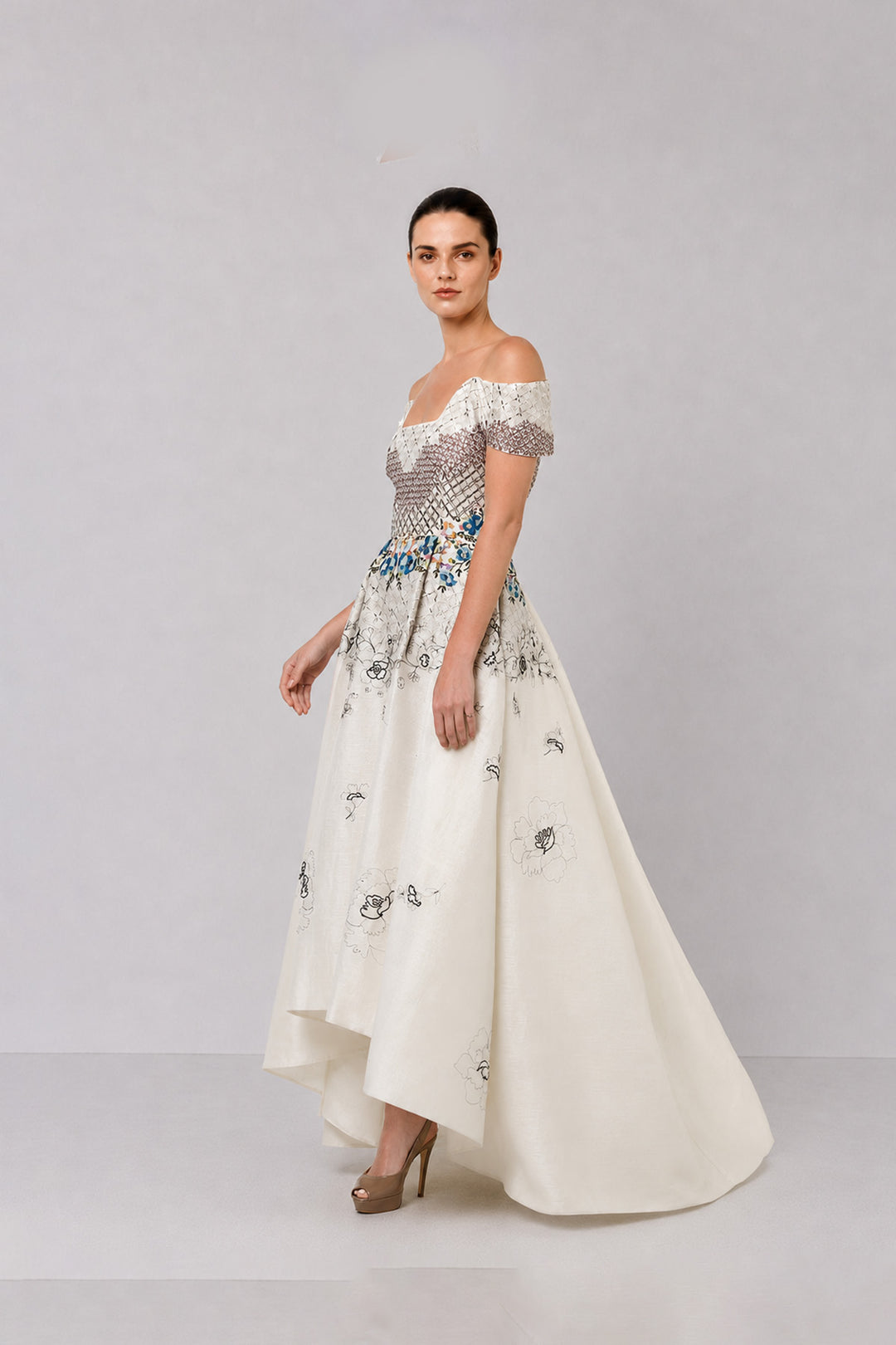 Ivory Off-Shoulder Dress With Embroidered Bodice And Dramatic High-Low Hem.