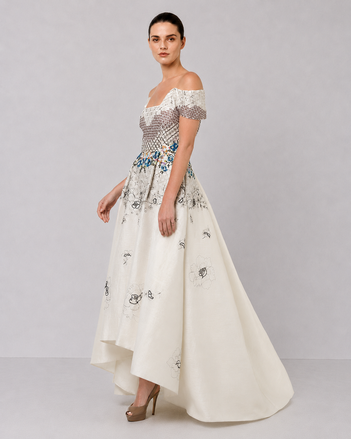 Ivory Off-Shoulder Dress With Embroidered Bodice And Dramatic High-Low Hem.