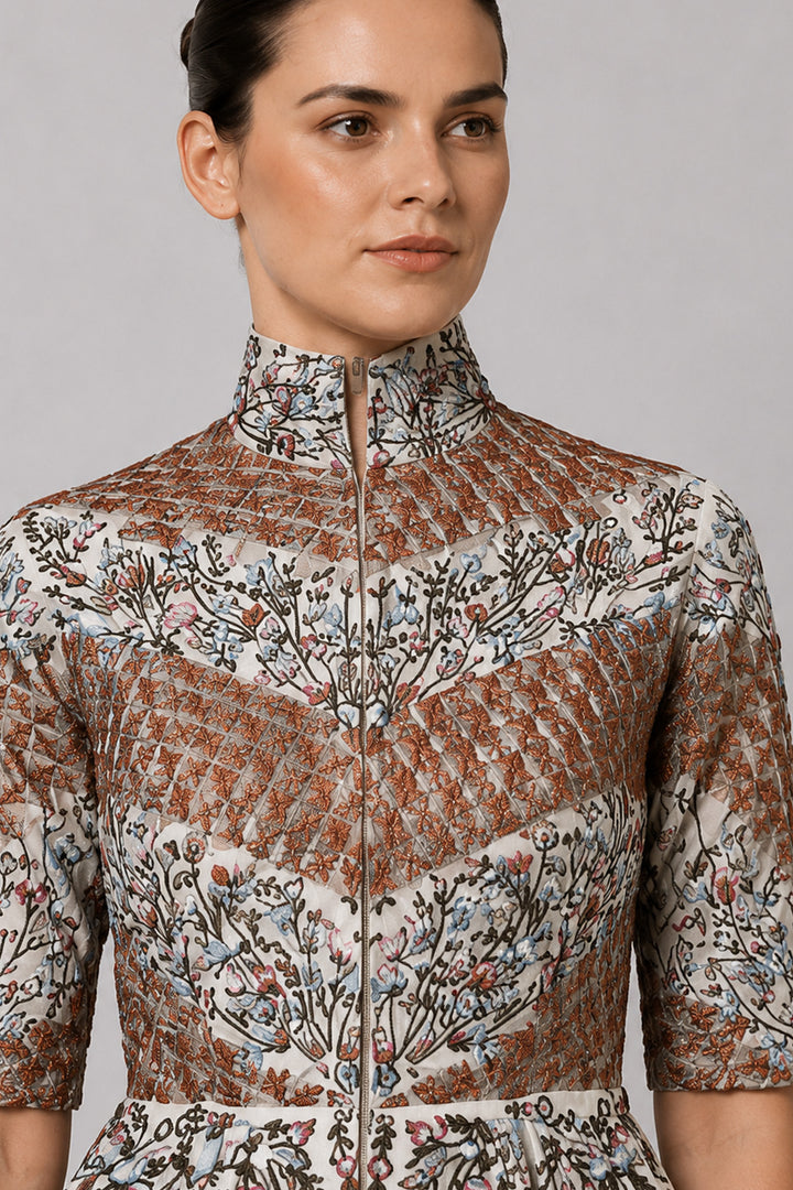 Ivory Embroidered Gown With Structured High Neck And Cascading Floral Motifs.
