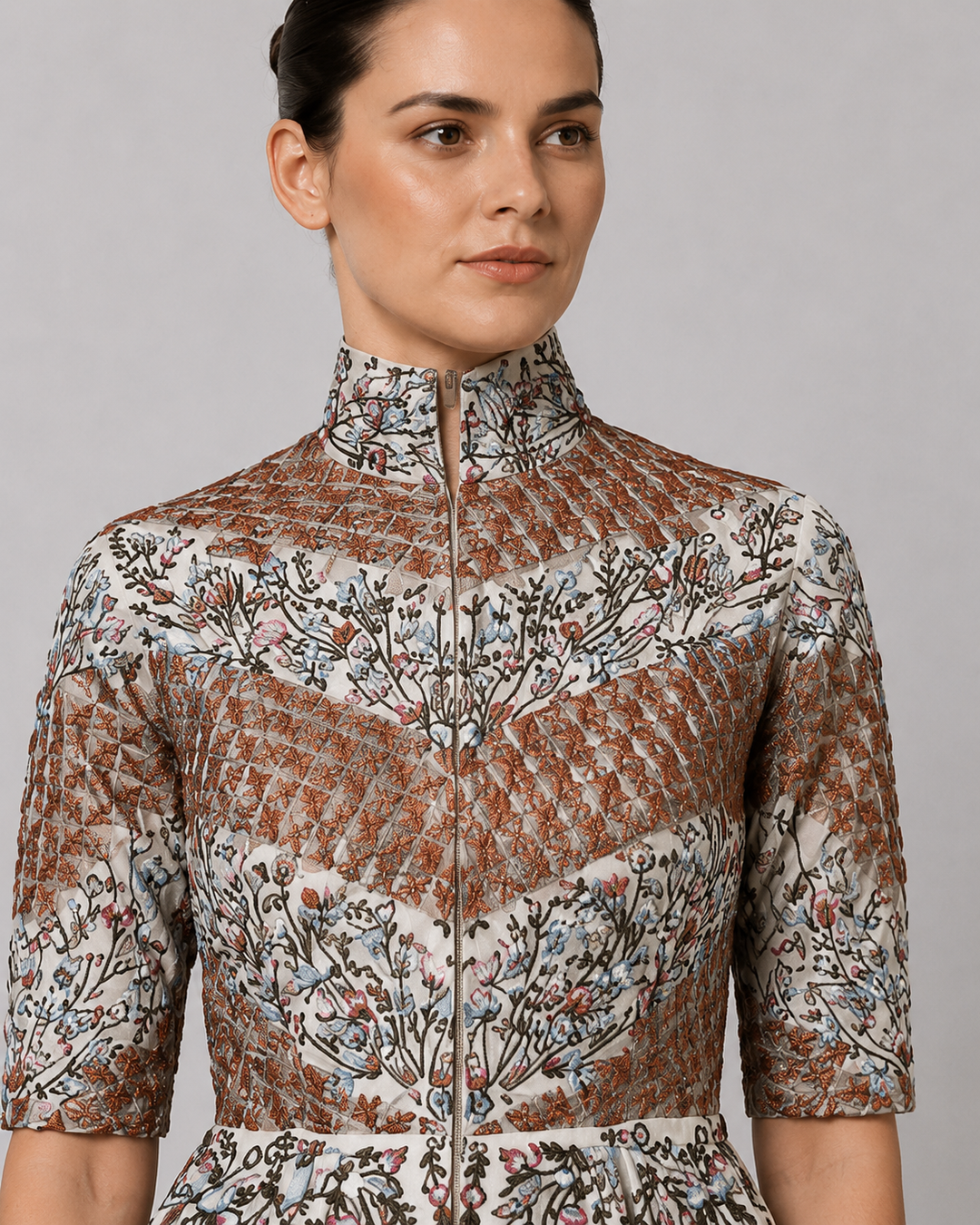 Ivory Embroidered Gown With Structured High Neck And Cascading Floral Motifs.