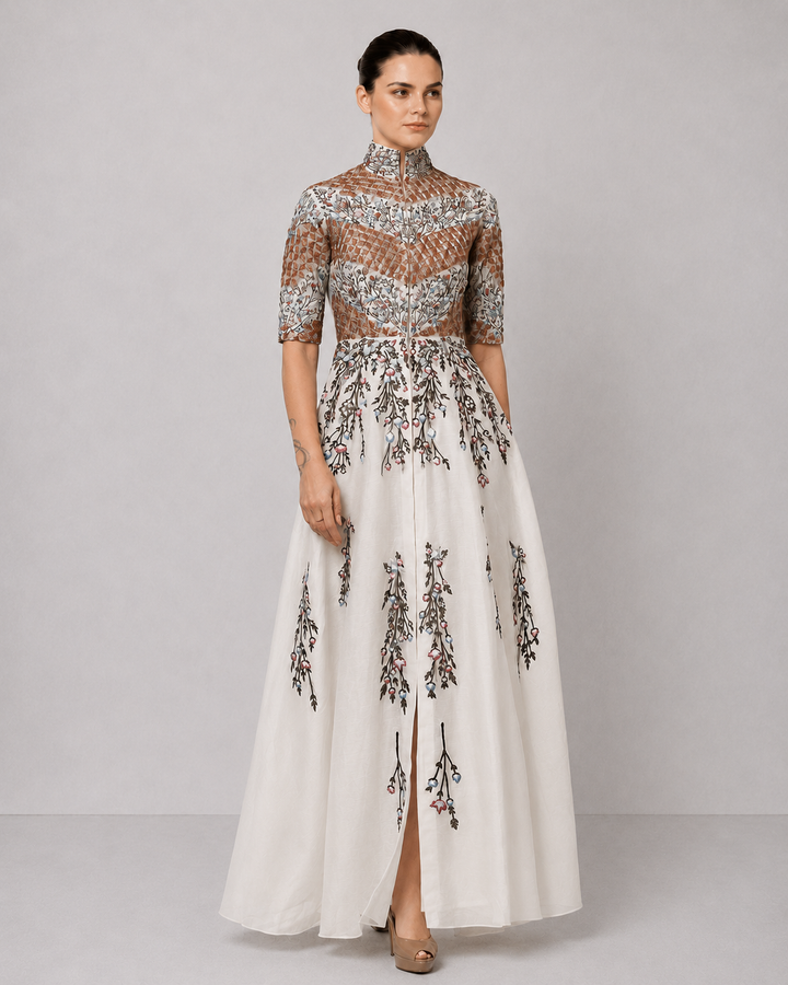 Ivory Embroidered Gown With Structured High Neck And Cascading Floral Motifs.