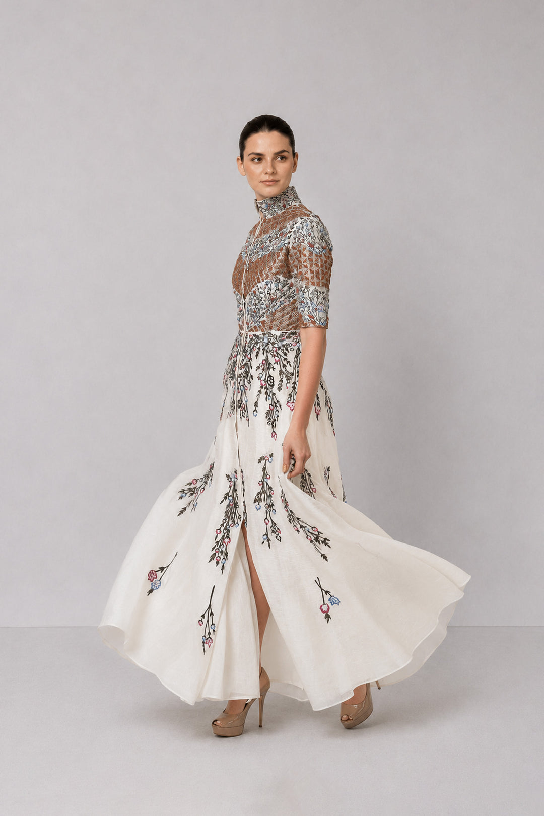 Ivory Embroidered Gown With Structured High Neck And Cascading Floral Motifs.