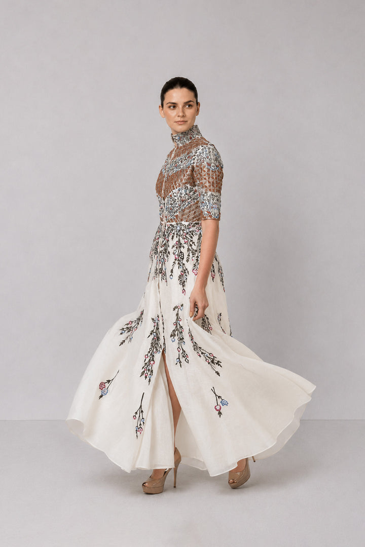 Ivory Embroidered Gown With Structured High Neck And Cascading Floral Motifs.