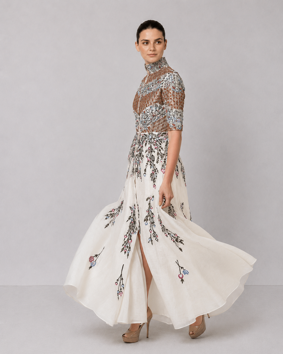 Ivory Embroidered Gown With Structured High Neck And Cascading Floral Motifs.