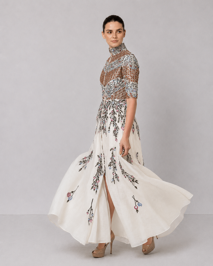 Ivory Embroidered Gown With Structured High Neck And Cascading Floral Motifs.