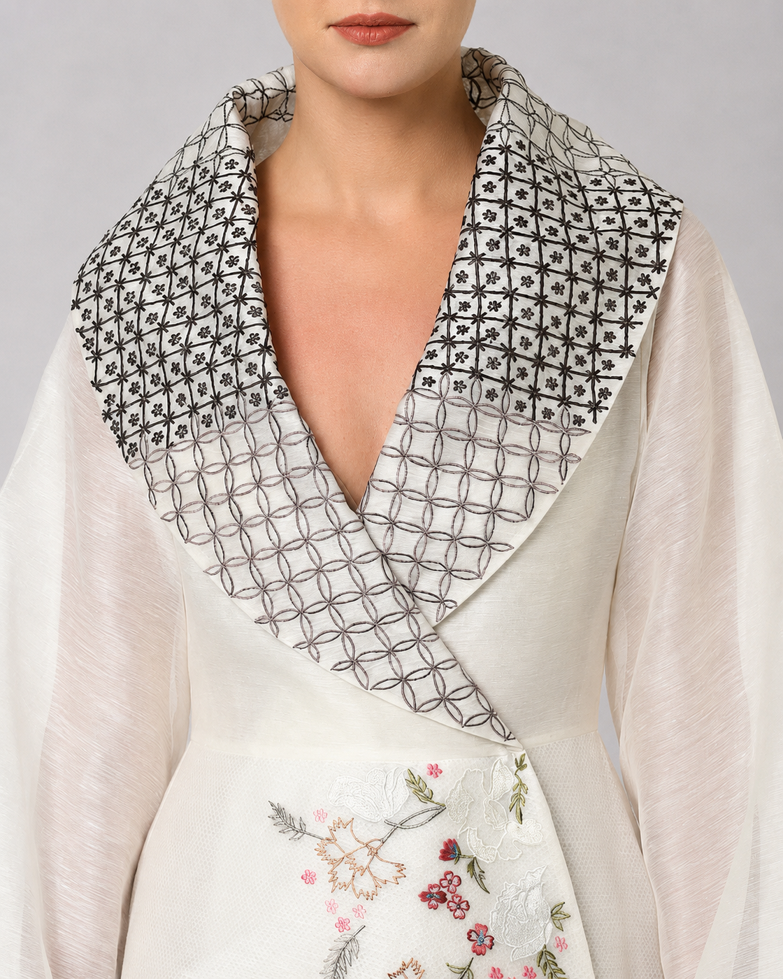 Ivory wrap gown with statement embroidered collar and sheer bell sleeves.